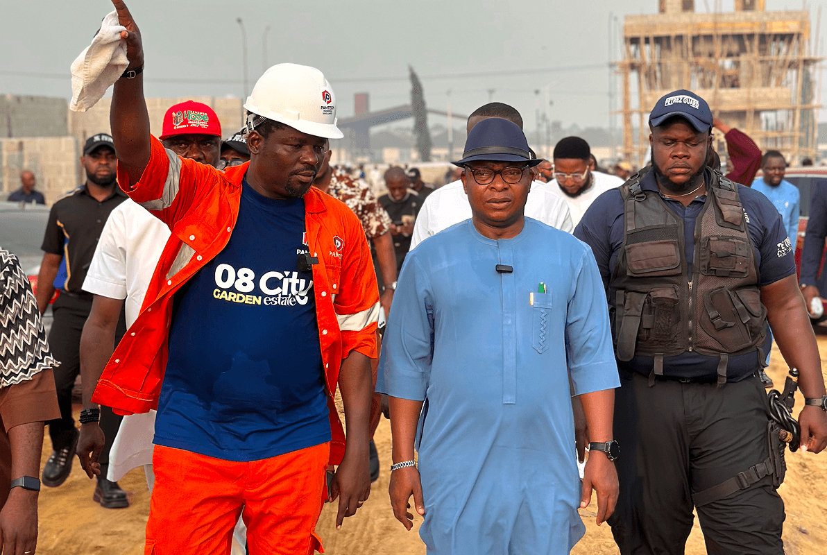 Officials and security walking the 08 City Garden Estate launch site